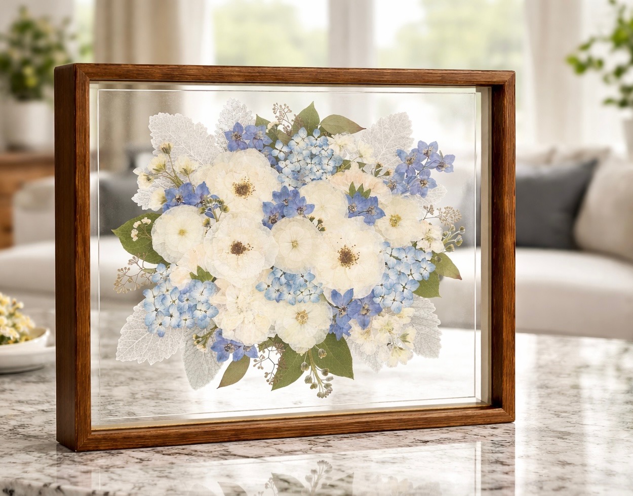 Blue hydrangea and white pressed flower bouquet preserved in a floating wooden frame